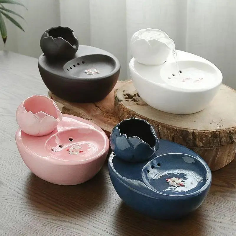 Ceramic pet water fountain with USB pump for cats and other pets to drink water.