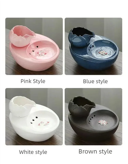 Ceramic pet water fountain with USB pump for cats and other pets to drink water.