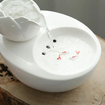 Ceramic pet water fountain with USB pump for cats and other pets to drink water.